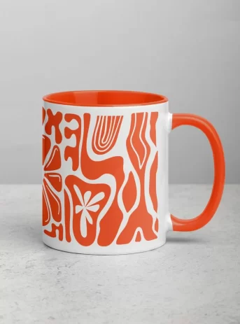 Ceramic mug with orange inside plus design