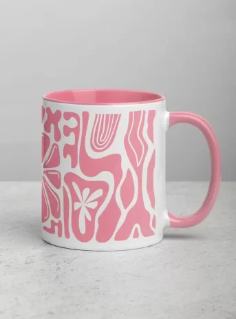Ceramic mug with pink inside plus design